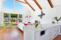  39 Makim St North Curl Curl NSW 2099 This is a family beachside classic two storey timber home. Set on a private 462 sqm – this street is fast becoming recognised for its peaceful demeanour, small reserve, and height offering water and district views. * Private from the street with established front hedges, delightful and sundrenched front sitting porch * Enormous family room with lounge and dining with a view through to the backyard * Open plan kitchen with gas cooking, stone island bench top with breakfast bar seating * High vaulted ceilings and second lounge area opening to the entertaining and BBQ with alfresco dining space * Four bedrooms all generous in size – the master offering water views and personal balcony * An amazing secret playroom/ or storage off the second bedroom * Modern bathrooms, rich hardwood timber flooring throughout * Swim spa and very private backyard, ample storage * Ducted reverse cycle a/c plus wall mounted split system A family favourite with the backyard and swim spa being able to be viewed from the kitchen and lounge areas. Close to primary and secondary school, local shops, reserves and playing fields. Size 462m² approx. 