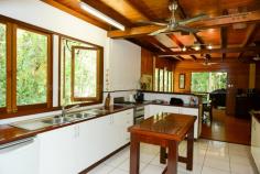  1 Gregory Terrace Kuranda QLD 4881 $575,000 negotiable Emaculate Pole Home in the Rainforest House - Property ID: 772920 This beautifully maintained timber pole home is situated on 1 acre within Kuranda's premiere Top of the Range rainforest estate. Surrounded by lush tropical, landscaped gardens and rainforest trees, this is a very private residence with electric gate entrance. Imagine starting your day with breakfast on the balcony amongst the birds, watching wallabies graze below. Sunset drinks on the front balcony finishes off the day nicely! Timber floors throughout, except the kitchen which has tiles on the floor. There are 4 bedrooms on 3 levels. Upstairs are 2 bedrooms and a bathroom, with a large living area perfect as a kids retreat or TV room. Mum and Dad's main bedroom on the middle level has a great en-suite with rainforest views.  The ground level had a bedroom and laundry with a loo, which could easily be converted to a granny flat or makes great accommodation for visiting relatives. There is nothing to do here! Just move right in and enjoy the rainforest lifestyle!   Print Brochure Email Alerts Features  Land Size Approx. - 4186 m2  Private rainforest block  1 acre Tropical gardens  Lots of storage  4 car parks  4 bedrooms  Large kitchen 