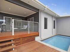  10 Westwood Street Banora Point NSW 2486  Contemporary Living at Its Best This striking home offers contemporary Australian family living at its best. If you've always wanted a low maintenance home set amongst nature, and also have every convenience at your fingertips, the complete package is presented here. Firstly, the layout of this quality builder's own home offers a range of attractive options. You may choose to accommodate your large family, set up a teenager's retreat, or enjoy the benefit of working from home with plenty of room to move. Throw open the sliding glass stacker doors to relax or entertain on the timber deck, with the gentle sound of majestic birdsong in the background, take a cooling dip in the private plunge pool, then perhaps move inside to enjoy a movie night in your own family-sized media room. Cooking is a pleasure in the designer kitchen, which offers a large walk-in pantry, gas cooktop, stainless steel range hood and dishwasher, plus stylish industrial-style feature lighting above the sleek stone bench tops. The open plan living and dining areas offer a spacious ambience and feature easy-care Blackbutt laminate flooring throughout. Your master suite offers a large walk-in robe, with an open ensuite showcasing feature tiles behind the dual vanity plus private toilet and shower. There are four additional bedrooms, all with built-in robes and brushed aluminium ceiling fans, three bathrooms in total plus a very spacious rumpus room. Just some of the extras include; Auto double garage with internal entry, high ceilings, fenced rear yard, under house storage and water tank. Owners keen to move on and have requested all offers be submitted. 