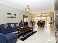  45 Seville Crest Mindarie WA 6030 For Sale $699,000 - $749,000 You can change anything in a house but you can never change the location and that is where this home screams great value. There is absolutely no need to change the size because this home is enormous. You have massive bedrooms, formal lounge/dining, separate games room, a study which could easily be the 5th bedroom and a more than spacious kitchen/meals all boasting high ceilings.  This property is located on one the loveliest streets, a very quiet and elevated spot on a good sized plot of land (680sqm) with plenty of room for a swimming pool if desired. The value of this property would rise dramatically with any sort of renovations because of the generous size and the location.  Here is a snap shot of the features:  Double Door Entry  Huge Lounge/Dining ideal to convert into a theatre and study  Five Bedrooms all more than adequate to accommodate Queen sized beds with the master being huge and framed by a bank of windows ? so pretty  Very generous ensuite and walk in robe separate WC, big bath and double sink vanity  Large open planned meals/family/kitchen  Extremely large kitchen allowing any budding chef to cook up a storm with wall oven and hot plate, stainless steel dishwasher and double fridge recess  Access from the double garage into the kitchen,  Separate Games Room or can be the theatre room  Sliding glass doors lead out to the patio from the meals area  Good sized patio with room at the back for the kids to play or install a pool in required  Split system air conditioners  Alarm System  Built approximately 1998  267 m2 (approx.) of home on a 680sqm block of land  Awesome location for quiet suburban living 