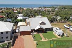  63 Lynda St Falcon WA 6210 WALK THROUGH THE FRONT DOOR INTO ANOTHER WORLD Price: Offers Over $699,000 This property will blow you away. The blockbuster estuary views and elevation of this property are just minor features of what this property offers. Suited comfortably for a family, a couple, or a holiday house – its functionality and layout will impress.  Featuring;  A 4 bedroom, 2 bathroom character home with estuary views from all the living areas Amazing master bedroom with large ensuite and built in robes, stunning wooden flooring & mood setting French doors leading out to the balcony  Offering a beautiful balcony overlooking the tree lined water views, with space for an outdoor setting and plenty of guests The balcony also over looks down on to the pool and spa area, with liquid limestone surround, fencing and a comfortable sitting area looking out into the garden, its only topped off by been a heated pool/spa to use all year round The games room down stairs looks out over the pool The appealing kitchen boasts gas cooking, a dishwasher, island bench, and a large pantry The dining and living areas all look out over the water views The upstairs living area has a charming pot belly adding to the homey atmosphere A laundry that will impress with storage capability and size  The three other bedrooms have great built in robes and access to a roomy bathroom  The powered workshop will make anyone needing a 'shed with all the extras' happy – including a sink and toilet Double garage with side access to the workshop  Extra side access parking – a retained area at the front of the property  And so much more! You will enjoy the inspection so book now! If you are looking for a home that offers views, lifestyle and a WOW factor – this is it. A walk-through is needed to truly appreciate the property 