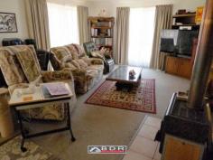  22 Kent St Torbanlea QLD 4662 For Sale   $280,000 Tradesman Paradise Brick & Tile Home approx 20 years young spacious open plan kitchen / dining / lounge, situated on a well established 4047m2 (1 acre).  Loads of garaging including: internal access double garage plus extra large workshop area, Large separate Caravan Shed with road base floor, single roller door, 6m x 7.5m x 3m approx, with a double carport attached. This Property Features: - Large open plan with designated living / dining and kitchen areas - Splendid kitchen, Gas cook top and oven, range-hood, space for a dishwasher,  large pantry, cupboards above & below with plenty bench space and breakfast bar. - Great dining area with room for a large setting. - The lounge-room is both comfortable and accommodating, with log burner fireplace, wall space for cabinets & lounge suite, coffee table & displays. - Spacious Master bedroom - air-conditioned, walk-in robe, huge ensuite with spa bath separate shower vanity and toilet. - Central common bathroom with Separate glass screened shower and vanity. - 3 Toilets including ensuite, separate central and another separate off of the entertaining area. - 4 telephone points including one in the garage. - Concrete circular driveway This home is service via septic and grey water systems, Rain water via an in-ground concrete tank of 5000 gal capacity, there is also a good sized dam with extensive irrigation via an electric Davey pump to yard taps for gardening. 