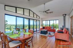  62 Outlook Rd Veteran QLD 4570 Offers Over $565,000 *Unrivalled panoramic views from every room *Modern Queenslander on 9 acres *3 Queen size bedrooms, office & media room *Master bedroom with walk in robe & ensuite *Kitchen with loads of storage & cupboards *Open plan living, timber floors & rake ceilings *Massive covered deck with panoramic views *30,000gal water capacity plus dam *Double garage underneath, sep 4-bay powered shed FOR SALE: Offers Over $565,000 With unrivalled panoramic views from every room, this modern Queenslander on 9 acres boasting a level football field sized backyard is simply stunning! This beautiful breezy home is the ultimate entertainer with its seamless indoor outdoor entertaining living and the unbelievably breathtaking views…….. and all of this located just minutes to the Gympie CBD !  Not only is this home an exceptional entertainer of generous proportions, it also boasts:  * 3 Queen size bedrooms plus separate office/4th bedroom and separate media room * Air conditioned master bedroom with walk in robe and ensuite * Light and airy kitchen features a 5 burner gas stove and double door electric oven, appliance cupboard, walk-in pantry, breakfast bar, plenty of drawers and clever storage options  * Spacious open plan living room with timber floors and rake ceilings * Open the stacker doors between the living areas and large covered deck to create an enormous entertaining area * Generous main bathroom with separate powder room and double vanity * 30,000 gallon water capacity plus dam * Powered 4-bay colourbond shed plus double garage underneath home * Designed to allow future dual living underneath if needed Prepared to be “WOWED” and come and discover this very appealing hidden gem today!  Copy & paste the following link to view property video:- http://youtu.be/iW8ehULdDSM Disclaimer All the above property information has been supplied to us by the Vendor. We do not accept responsibility to any person for its accuracy and do no more than pass this information on. Interested parties should make and rely upon their own enquiries in order to determine whether or not this information is in fact accurate. Intending purchasers should seek legal and accounting advice before entering into any contract of purchase. 