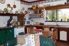  74 Walter St Balingup WA 6253 545,000 Property type: Acreage / Semi-Rural Suburb: Balingup (profile) Region: Southern Land area: 0 sqmCHARACTER AND CHARM This delightful 4 bedroom, 2 bathroom home, hidden on just over 4 acres, has warmth, character and a great feeling of homeliness. The welcoming country charm is apparent from the moment you enter through the front door, with it's beautiful leadlight insert and sidelights, to the little wooden steps leading up to the bedroom in the attic with panoramic views from the dormer windows. The home has a lovely cottage ambience, and is awaiting new custodians to enjoy it's character and charm. With many traditional features, the home has instant country appeal, yet has all the modern comforts of today. The farmhouse kitchen has terracotta style tiles, and a slow combustion stove to keep the home warm and cosy during cooler winter months. The lounge has beautiful views , ornate ceiling rose, and a welcoming brick fireplace.  Another entry in to the house is through a welcoming tiled foyer, leading into a studio with high ceilings and exposed wooden framework.  Established deciduous trees surround the house. In autumn and winter the leaves fall, allowing the light and warmth of the winter sun into the house. New leaves emerge in spring, and in summer the dappled light and canopy of the shady trees provide shelter for the cottage gardens and prolific bird life. Enjoy picking tree-ripened fruit from the assortment of fruit trees, and enjoy making pies or bottling fruit from the freshly-picked harvest.  Country living doesn't get much better than this! The property also has a large workshop/garage and has two large rain-water tanks. For more information, please call either John or Sue on 97641089 