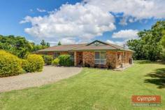  23 Running Creek Rd Kilkivan QLD 4600 $345,000.00 *4 bedroom, 2 bathroom lowset brick home *Media room or 5th bedroom, formal entry *Open plan kitchen, dining & living area *Sec screens, ceiling fans, air conditioning *Huge undercover patio & BBQ area *11m x 4m x 3.5m shed plus 6m x 3.5m shed *2 x carports, 3KW solar, 2 x 10,000L tanks *Fully fenced 1 acre, fire pit & views FOR SALE: $345,000 Nothing more to do, nothing more to spend! Just sit back, relax and enjoy yourself in a superb, quality home whilst enjoying the quaint, rural, country town charm and lifestyle that Kilkivan has to offer! * Beautifully maintained and presented, quality lowset brick veneer home  * 4 large carpeted bedrooms all with ceiling fans and built in wardrobes * Main bedroom features large built ins, air conditioning and huge modern ensuite * Separate media room, could be used as a 5th bedroom option or guest sleep-out * Formal entry leads to tiled open plan kitchen, dining and air conditioned lounge * Lounge opens onto huge, private undercover pebblecrete patio and BBQ area 	 * Large kitchen with modern, quality appliances, loads of storage and big pantry * Roomy laundry with linen storage and easy access to patio and clothesline * Security screens, blinds and ceiling fans throughout, satellite TV * Large 11m x 4m x 3.5m shed with high clearance roller door, suitable for caravan or boat * 6m x 3.5m lockable, powered shed with workbench can be used as extra garage * 2 x extra carports with shade screens, 3KW solar system * Connected to town water supply with the added bonus of 2 x 10,000L rainwater tanks * Fully fenced one acre block with lovely established trees and gardens  * Quality landscaping, fire pit, privacy and views of the mountains * 1km to town, school bus service to Gympie high schools, less than 40 mins to Gympie * Central to Gympie, Goomeri, Murgon, Bjelke-Petersen Dam and the South Burnet wine trail All of this within walking distance to Kilkivan town with cafes, shops, hotel, primary school, parks and sport facilities. This is affordable, quality living, central to everything the South Burnett and Gympie regions have to offer!  Copy & paste the following link to view property video:- http://youtu.be/P6_WcjKGOuk Disclaimer All the above property information has been supplied to us by the Vendor. We do not accept responsibility to any person for its accuracy and do no more than pass this information on. Interested parties should make and rely upon their own enquiries in order to determine whether or not this information is in fact accurate. Intending purchasers should seek legal and accounting advice before entering into any contract of purchase. 