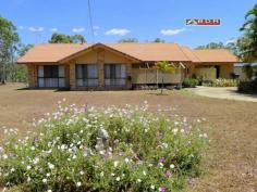  22 Kent St Torbanlea QLD 4662 For Sale   $280,000 Tradesman Paradise Brick & Tile Home approx 20 years young spacious open plan kitchen / dining / lounge, situated on a well established 4047m2 (1 acre).  Loads of garaging including: internal access double garage plus extra large workshop area, Large separate Caravan Shed with road base floor, single roller door, 6m x 7.5m x 3m approx, with a double carport attached. This Property Features: - Large open plan with designated living / dining and kitchen areas - Splendid kitchen, Gas cook top and oven, range-hood, space for a dishwasher,  large pantry, cupboards above & below with plenty bench space and breakfast bar. - Great dining area with room for a large setting. - The lounge-room is both comfortable and accommodating, with log burner fireplace, wall space for cabinets & lounge suite, coffee table & displays. - Spacious Master bedroom - air-conditioned, walk-in robe, huge ensuite with spa bath separate shower vanity and toilet. - Central common bathroom with Separate glass screened shower and vanity. - 3 Toilets including ensuite, separate central and another separate off of the entertaining area. - 4 telephone points including one in the garage. - Concrete circular driveway This home is service via septic and grey water systems, Rain water via an in-ground concrete tank of 5000 gal capacity, there is also a good sized dam with extensive irrigation via an electric Davey pump to yard taps for gardening. 
