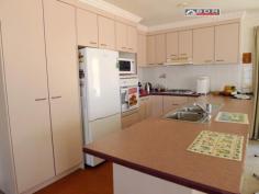  22 Kent St Torbanlea QLD 4662 For Sale   $280,000 Tradesman Paradise Brick & Tile Home approx 20 years young spacious open plan kitchen / dining / lounge, situated on a well established 4047m2 (1 acre).  Loads of garaging including: internal access double garage plus extra large workshop area, Large separate Caravan Shed with road base floor, single roller door, 6m x 7.5m x 3m approx, with a double carport attached. This Property Features: - Large open plan with designated living / dining and kitchen areas - Splendid kitchen, Gas cook top and oven, range-hood, space for a dishwasher,  large pantry, cupboards above & below with plenty bench space and breakfast bar. - Great dining area with room for a large setting. - The lounge-room is both comfortable and accommodating, with log burner fireplace, wall space for cabinets & lounge suite, coffee table & displays. - Spacious Master bedroom - air-conditioned, walk-in robe, huge ensuite with spa bath separate shower vanity and toilet. - Central common bathroom with Separate glass screened shower and vanity. - 3 Toilets including ensuite, separate central and another separate off of the entertaining area. - 4 telephone points including one in the garage. - Concrete circular driveway This home is service via septic and grey water systems, Rain water via an in-ground concrete tank of 5000 gal capacity, there is also a good sized dam with extensive irrigation via an electric Davey pump to yard taps for gardening. 