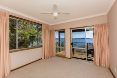  35 Nords Wharf Rd, Nords Wharf NSW 2281 FOR SALE:   OFFERS OVER $1,100,000   The new owners of this absolute waterfront home will feel like they are on holidays 52 weeks a year. Never a dull moment as you soak up the sun and watch the boats go by from your bedrooms and light filled living room. This deep water frontage property is ideal for the water lover with the owners having made extensive use of their 36ft cruiser over the years to enjoy the lake lifestyle. The owner advises the depth at the end of the jetty is over 5 feet. This has been a lifestyle weekender for its Sydney owners who have enjoyed all the property and Lake Macquarie has to offer for the past 18 years with many a feed of Flathead caught off the jetty. With easy access to both Sydney and Newcastle, this is the ideal private lake residence or weekend getaway. The split level home features oversized double garage with internal access, tiled entry foyer, main bathroom and three bedrooms two open onto the north facing deck overlooking the lake. The lower level features second bathroom and the laundry as well as a large kitchen with dishwasher and breakfast bar and big Open Plan living area that takes full advantage of the prevailing views and location. The basement area features tiled utility room with storage under the stairs and two boat sheds – one electric and one manual winch as well as a slipway and jetty. Set on over 770 square metres of land. This is for the active water lover, you will be hard pressed to find a home closer to the water. The owners will miss the School Holidays spent by the lake with the family and friends but its now time for new owners to enjoy the property. 
