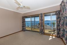  35 Nords Wharf Rd, Nords Wharf NSW 2281 FOR SALE:   OFFERS OVER $1,100,000   The new owners of this absolute waterfront home will feel like they are on holidays 52 weeks a year. Never a dull moment as you soak up the sun and watch the boats go by from your bedrooms and light filled living room. This deep water frontage property is ideal for the water lover with the owners having made extensive use of their 36ft cruiser over the years to enjoy the lake lifestyle. The owner advises the depth at the end of the jetty is over 5 feet. This has been a lifestyle weekender for its Sydney owners who have enjoyed all the property and Lake Macquarie has to offer for the past 18 years with many a feed of Flathead caught off the jetty. With easy access to both Sydney and Newcastle, this is the ideal private lake residence or weekend getaway. The split level home features oversized double garage with internal access, tiled entry foyer, main bathroom and three bedrooms two open onto the north facing deck overlooking the lake. The lower level features second bathroom and the laundry as well as a large kitchen with dishwasher and breakfast bar and big Open Plan living area that takes full advantage of the prevailing views and location. The basement area features tiled utility room with storage under the stairs and two boat sheds – one electric and one manual winch as well as a slipway and jetty. Set on over 770 square metres of land. This is for the active water lover, you will be hard pressed to find a home closer to the water. The owners will miss the School Holidays spent by the lake with the family and friends but its now time for new owners to enjoy the property. 
