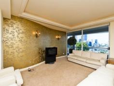  2/14 Bellevue Terrace West Perth WA 6005 FOR SALE PRICE: OFFERS FROM $3,950,000 COUNCIL RATES: $3,410 per year WATER RATES: $2,236 per year STRATA LEVY: $8,661 per quarter INSPECTION: Contact agent for details BEDROOMS: 3 BATHROOMS: 3 CAR SPACES: 3 DAZZLING VIEWS FOREVER Bellevue Terrace has been the jewel in the crown of residential real estate in Perth. The building stands on the boundary of beautiful Kings Park commanding an endless vista across the city to the Darling Ranges and the Swan River. 14 Bellevue contains 5 apartments over 6 levels and was architecturally designed to maximise the advantages of the site and provide comfortable luxurious residences that would do justice to the exclusive location. On the lower level there is the generous sized master suite with a huge walk in robe and en suite bathroom. Off the main bedroom there is a large living and dining area complete with a built in gas fire place. The living room has access to a large terrace, perfect for entertaining whilst overlooking the Swan River and City. The fabulous kitchen and family room are adjacent to the private courtyard. The upper lever consists of 2 secondary bedrooms as well as the study area and split bathroom. The apartment complex boasts a recently renovated heated indoor swimming pool, spa and sauna. There is also secure garaging on the basement level for 3 cars. With breathtaking views in a fabulous location this property is a must see.   
