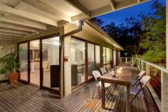  25 Moonbi Crescent, Frenchs Forest, NSW 2086 Offers Over $915,000 A family home, central to everything in a quiet cul de sac, enjoying secluded bush views and a sense of being miles from the hustle and bustle. From the moment you enter you'll be captivated by the never to be built out, serene treetop views.  On entry level, an expansive living area opens directly to the generous wraparound covered deck. A cosy slow combustion stove makes this space inviting in all seasons. Three good sized bedrooms are serviced by a family bathroom with spa. The lower level offers versatility with a workshop, storeroom, laundry and possible home office with access to the rear garden. The palm fringed, in-ground swimming pool and low maintenance gardens further enhance the tropical hideaway ambience. Just a short walk to schools, Forestway Shopping Centre and city buses. This residence offers the opportunity to further enhance its appeal with your own individual style. 