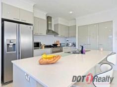  28 Quayside Drive Riverlinks Helensvale Qld 4212 $1,000,000 SPACIOUS MODERN WATERFRONT HOME This modern contemporary waterfront home with entry via a free-standing gatehouse, formal and casual living areas, plus media room, are separated by a private courtyard streaming with natural light and filtered breezes for year round comfort. The master suite with a private undercover balcony overlooks the sparkling pool and expansive views of the River Links waterways and beyond. Bathrooms include floor to ceiling tiling, contrasting wall panels and glossy cabinet finishes. The kitchen features stainless steel appliances, an island bench offering the versatility of breakfast bar seating, and an open spacious feel . The alfresco entertaining deck with BBQ, overlooks the pool and the 20 square meter pontoon for the boat enthusiast completes this waterfront package. Less than 600 meters to the Coomera River providing convenient passage to the ocean. Don’t miss this opportunity to become part of the River links community Close to the M1 prestigious school’s Medical facilities, the marina precinct to enjoy restaurants and cafes and the famous Santuary Cove. Golfing enthusiasts this is a must see. Call Michelle now on 0421608087 for inspection. 