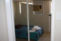  4 Holliman Street Charters Towers Qld 4820 FOR SALE $135,000 An excellent tenant is currently paying $180 per week.  - Neat kitchen  - Fresh new vinyl & tiled throughout  - 1 bedroom with walk through to smaller room. Would make excellent walk in robe  - 2 living areas (one area could be make into 2nd bedroom)  - Modern bathroom with shower, new vanity & separate toilet  - Air-con throughout  - Carport  - Garden shed & fernery  - Very neat, manageable yard  - Fully fenced     PROPERTY DETAILS Property Id: 61446180 Available: December 1, 2014 