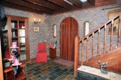  30 Laslett Cir Mundaring WA 6073 for sale  $695,000 A VERY SPECIAL HOME Tudor Homes have their roots in the pastoral Cotswold region of England and were built in the 1500's during the Tudor Dynasty. This modern excellent Tudor Style or Tudor Revival home will remind you of a cozy storybook home, set in the picturesque hills environs of rural Mundaring. A spacious entrance hall welcomes invitees into an atmosphere of hospitality, entertain in the formal living area (lounge and dining) with soaring ceilings that give a more than generous sense of space, or an informal coffee in the country style kitchen/meals and finally relax in the welcoming family room. PLUS: 4 generous bedrooms, an upstairs main bathroom and downstairs 2nd bathroom incorporated into the laundry, an activity room and study with built in furniture with a relaxing view of the majestic gum trees and plentiful birdlife. Cool evaporative ducted air-conditioning for those lazy summer days, warm gas and wood fired heating for those cold wintry nights. PLUS: Entertain family and friends outdoors in the large patio with built in speakers or meander out onto the decking and have a refreshing dip in the swimming pool and there’s more ………….  Why not view and chat with the professional and helpful Woodville Property consultants on site during Home Opens or at your selected Private Inspections? 