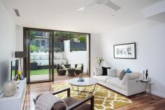 4/95 Wentworth Street, RANDWICK, NSW 2031 Drawing inspiration from the Australian landscape and seamlessly blending the raw and refined, Akora brings a fresh level of sophistication to the northern Randwick precinct and is a new landmark in this sought after address. The Townhouse @ Akora is a tribute to bespoke understated luxury, a restrained neutral palette and a feeling of space and light throughout.  This townhouse features the entire ground level dedicated to open plan living and dining flowing to landscaped courtyard gardens for ease of entertaining and a stunning caeserstone kitchen showcasing Bosch appliances. Upstairs the 2 bedrooms both with fabulous built-in robes (main with ensuite), main bathroom (with bath) and hidden internal laundry. A selection of the finest finishes include beautiful spotted gum timber flooring, porcelain floor tiles, custom joinery, ducted reverse cycle air conditioning, security intercoms and alarms. Featuring a single basement car space plus secure storage cage, a private rear lane entry via Waverley Street into the courtyard garden. 