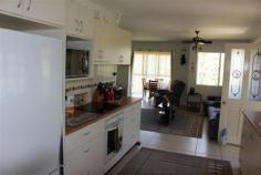  6/277 Haly Street Kingaroy Qld 4610 $178,000 PERFECT STARTER / INVESTMENT 2 1 1 This double level townhouse offers the investor or owner/occupier an easy-care comfortable living option. Situated within walking distance to the Kingaroy CBD, schools and community pool it is in excellent order/presentation. 24 hours notice required as tenants are in place. Features include:- Upstairs  -2 bedrooms with built-in robes and fans -Bathroom/toilet Downstairs -Living area -Kitchen with breakfast bar -Reverse cycle air-conditioner -Single lock-up garage -Laundry and 2nd toilet -Covered and screened alfresco area -Large backyard and rainwater tank -Close to shops, school and pool -Situated well off the street Call now for an inspection.   Inspection Times Contact agent for details Land Size 176 m2 