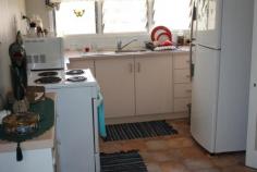  4 Holliman Street Charters Towers Qld 4820 FOR SALE $135,000 An excellent tenant is currently paying $180 per week.  - Neat kitchen  - Fresh new vinyl & tiled throughout  - 1 bedroom with walk through to smaller room. Would make excellent walk in robe  - 2 living areas (one area could be make into 2nd bedroom)  - Modern bathroom with shower, new vanity & separate toilet  - Air-con throughout  - Carport  - Garden shed & fernery  - Very neat, manageable yard  - Fully fenced     PROPERTY DETAILS Property Id: 61446180 Available: December 1, 2014 