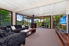 25 Moonbi Crescent, Frenchs Forest, NSW 2086 Offers Over $915,000 A family home, central to everything in a quiet cul de sac, enjoying secluded bush views and a sense of being miles from the hustle and bustle. From the moment you enter you'll be captivated by the never to be built out, serene treetop views.  On entry level, an expansive living area opens directly to the generous wraparound covered deck. A cosy slow combustion stove makes this space inviting in all seasons. Three good sized bedrooms are serviced by a family bathroom with spa. The lower level offers versatility with a workshop, storeroom, laundry and possible home office with access to the rear garden. The palm fringed, in-ground swimming pool and low maintenance gardens further enhance the tropical hideaway ambience. Just a short walk to schools, Forestway Shopping Centre and city buses. This residence offers the opportunity to further enhance its appeal with your own individual style. 