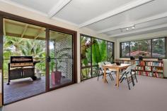  25 Moonbi Crescent, Frenchs Forest, NSW 2086 Offers Over $915,000 A family home, central to everything in a quiet cul de sac, enjoying secluded bush views and a sense of being miles from the hustle and bustle. From the moment you enter you'll be captivated by the never to be built out, serene treetop views.  On entry level, an expansive living area opens directly to the generous wraparound covered deck. A cosy slow combustion stove makes this space inviting in all seasons. Three good sized bedrooms are serviced by a family bathroom with spa. The lower level offers versatility with a workshop, storeroom, laundry and possible home office with access to the rear garden. The palm fringed, in-ground swimming pool and low maintenance gardens further enhance the tropical hideaway ambience. Just a short walk to schools, Forestway Shopping Centre and city buses. This residence offers the opportunity to further enhance its appeal with your own individual style. 