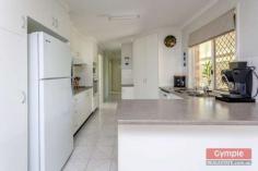  23 Running Creek Rd Kilkivan QLD 4600 $345,000.00 *4 bedroom, 2 bathroom lowset brick home *Media room or 5th bedroom, formal entry *Open plan kitchen, dining & living area *Sec screens, ceiling fans, air conditioning *Huge undercover patio & BBQ area *11m x 4m x 3.5m shed plus 6m x 3.5m shed *2 x carports, 3KW solar, 2 x 10,000L tanks *Fully fenced 1 acre, fire pit & views FOR SALE: $345,000 Nothing more to do, nothing more to spend! Just sit back, relax and enjoy yourself in a superb, quality home whilst enjoying the quaint, rural, country town charm and lifestyle that Kilkivan has to offer! * Beautifully maintained and presented, quality lowset brick veneer home  * 4 large carpeted bedrooms all with ceiling fans and built in wardrobes * Main bedroom features large built ins, air conditioning and huge modern ensuite * Separate media room, could be used as a 5th bedroom option or guest sleep-out * Formal entry leads to tiled open plan kitchen, dining and air conditioned lounge * Lounge opens onto huge, private undercover pebblecrete patio and BBQ area 	 * Large kitchen with modern, quality appliances, loads of storage and big pantry * Roomy laundry with linen storage and easy access to patio and clothesline * Security screens, blinds and ceiling fans throughout, satellite TV * Large 11m x 4m x 3.5m shed with high clearance roller door, suitable for caravan or boat * 6m x 3.5m lockable, powered shed with workbench can be used as extra garage * 2 x extra carports with shade screens, 3KW solar system * Connected to town water supply with the added bonus of 2 x 10,000L rainwater tanks * Fully fenced one acre block with lovely established trees and gardens  * Quality landscaping, fire pit, privacy and views of the mountains * 1km to town, school bus service to Gympie high schools, less than 40 mins to Gympie * Central to Gympie, Goomeri, Murgon, Bjelke-Petersen Dam and the South Burnet wine trail All of this within walking distance to Kilkivan town with cafes, shops, hotel, primary school, parks and sport facilities. This is affordable, quality living, central to everything the South Burnett and Gympie regions have to offer!  Copy & paste the following link to view property video:- http://youtu.be/P6_WcjKGOuk Disclaimer All the above property information has been supplied to us by the Vendor. We do not accept responsibility to any person for its accuracy and do no more than pass this information on. Interested parties should make and rely upon their own enquiries in order to determine whether or not this information is in fact accurate. Intending purchasers should seek legal and accounting advice before entering into any contract of purchase. 