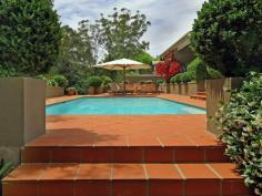  72 Yarrabung Rd St Ives NSW 2075 "VILLA GRANA" ULTIMATE PRIVATE ENTERTAINER Majestically set back from the street with a long paved driveway framed by stunning Cypress Pine and Japanese Box hedges, this ULTRA PRIVATE, Mediterranean influence family residence combines character and contemporary design. Enjoying the versatility of DUAL OCCUPANCY, this stunning home is nestled on an impressive block 1,741sqm approx and offers the ultimate in resort-style living for families that love to entertain. A large North facing sun room and covered terrace stretch the length of the house which flows to opulent and private alfresco entertainment areas, including a sun drenched North facing large swimming pool and spa with a built in barbecue surrounded by stunning manicured gardens. From its imposing Travertine entrance to the open plan kitchen with marble bench tops (island bench) and Miele appliances, the home opens onto a beautiful back garden with expansive level lawns that will be perfect for a game of backyard cricket. The attached apartment is ideal for in laws or family accommodation and includes 2 bedrooms, a bathroom, a spacious dining/lounge area, a lovely kitchen with granite bench tops and a meal area that flows to a private outdoor deck, ideal for alfresco dining. Other features include an immaculate paved driveway with a three car garage and extra parking spaces. The manicured landscape gardens enhance the peace and tranquility of the home. Conveniently located just minutes' walk to St Ives Primary and High schools, bus to city and Gordon station and with easy access to St Ives Shopping Village and many of the area's best schools, including Masada, Brigidine College and Sydney Grammar Prep, this whisper quiet home commands attention. * Striking travertine front entrance and spacious light-filled interiors * Vast open plan formal living and dining with a built in fire place  * Sundrenched sitting area with bay windows overlooking private garden surrounds * Gourmet kitchen with Carrera marble island benchtop and Miele appliances * Five generous bedrooms with built ins, master with ensuite and adjoining home office * Travertine family bathroom; polished timber floors in living; plantation shutters * Downstairs rumpus adjacent to swimming pool ideal for a game of table tennis * Dual occupancy boasting separate granite kitchen, spacious living and dining * Three-car garage with storage and internal access, security gates * Expansive under-house wine cellar, ample storage, central heating * Spacious laundry  * Private and secure This amazing residential setting is a MUST TO INSPECT!! 