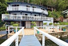  6 Silverwater Estate Berowra Waters NSW 2082 With only 45 minutes to the CBD, this north east facing home hosts a unique lifestyle opportunity on Sydney's glistening Berowra Waters. Boasting over 4 levels of spacious comfort with 3 levels flowing to it's own entertainers balcony through a spectacular glass surround, this property is an absolute gem. Featuring: Entry level * Deep water mooring suitable for a large heavy vessel * Brand new pontoon and jetty with new seawall * Private slipway for boat maintenance & adjoining stairs * Brilliant open plan courtyard with generous storage * 5th bedroom / guest studio with separate toilet First Level * Vogue style kitchen with beautiful stainless steel appliances * Large living & dining area with spectacular glass surround * Entertainers deck flowing the entire length of second level * Air conditioning & separate heating Second Level * Boasting three large bedrooms with built in robs & ensuite to one * Each bedroom open to its own romantic deck for star gazing * Modern bathroom with separate toilet * Internal laundry & air conditioning Third Level * Loft style bedroom adjoining through private staircase with private bathroom & built in robe * Expansive rear garden that is fully terraced and landscaped Included in the property are two Quinrex 40HP commuter boats to take you on the short 3 minute trip to the secure residents marina & car park. With this residence ticking all the box's, an inspection is a must Property Type House  Property ID 11437110039  Street Address 6 Silverwater Estate  Suburb Berowra Waters 