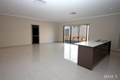  1/7 Burrundulla Road Bourkelands NSW 2650 $379,000 Luxury unit Villa - Property ID: 496546 First impressions do count... Designed for the busy lifestyle these low maintenance luxury executive units both incorporate four bedrooms into a quality filled floor plan that will definitely capture your attention. - Presenting four bedrooms, three bedrooms with built-in robes and a large master with walk-in robe and ensuite - A spacious kitchen features an abundance of storage, Caesar stone bench tops, walk-in pantry and a 900mm stainless steel Omega oven/gas cooktop - Open plan living incorporates the kitchen, meals and living area flowing through to the outdoor entertaining area - The main bathroom contains a bath, shower, vanity and toilet with floor to ceiling tiles - Features that make a difference include nine foot ceilings, large polished porcelain tiles, down lights throughout and heating/cooling - A single lock-up garage with internal access and a low maintenance rear yard make living simple   Print Brochure Video Email Alerts Features  Large open plan living  Quality kitchen  Low maintenance  Porcelian polished tiles  Ensuite to master  Stainless steel Omega oven 