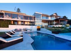  16 Old Ferry Rd Banora Point NSW 2486 Property Type 	 House Bedrooms 	 4 Bathrooms 	 4 Carspaces 	 4 Sweeping 180 degrees ocean and hinterland views from Fingal to Byron Bay Lighthouse with meandering waterways dominate from almost every room of this spectacular four bedroom contemporary masterpiece. Designed by renowned Noosa architect Paul Clout and constructed by award winning Hammerhead Builders, this extremely spacious home offers a wonderful sense of relaxed comfort. The main expansive living area incorporates an award winning kitchen with Butlers kitchen (designed by Lee Hardcastle) which flows to the outdoor entertaining area comfortably warmed by sensored heating. Below sits the resort style pool and gazebo against mature landscaped gardens. Also on this level are two private en suite guest rooms, a well appointed office and generous dual entertaining areas with a fully insulated wine cellar. Upstairs a floating glass bridge leads to a magnificent master suite, complete with an enviable custom designed walk-in robe and bathroom featuring floor to ceiling marble and a free standing marble bath positioned to take the coastal views that stretch to the horizon. The second en suite bedroom is equally opulent with its own study and private covered deck set against a lush garden backdrop. The north wing has an intimate second living area with Calcutta marble fireplace. Throughout natural stone walls, travertine external paving, spotted gum flooring, copper downpipes, custom cedar windows and bi fold doors cap a truly remarkable residence built with attention to detail, highest quality finishes and craftsmanship, functionality and complete privacy. This iconic residence is ready for the discerning buyer who seeks an exceptional residence. - Two Master Suites with marble Bathrooms and large Dressing Rooms - Heated flooring to En suite, Villeroy and Boch fittings - Glass walling in Showers, automated Window Coverings - Fully sound proofed 10-seat home Theatre - Intergrated master Kitchen with Butlers second Kitchen-Pantry - Sports/Pool Room and Putting Green - Resort-style Pool, BBQ area, Gym with Steam Room - C-Bus technology and ducted Air Conditioning FOR FURTHER INFORMATION PLEASE CONTACT Lorna Savage from LS Properties on 0408 337 122 Disclaimer: All information contained herein is gathered from sources we believe reliable. We have no reason to doubt its accuracy, however we cannot guarantee it. All interested parties should make & rely upon their own inquiries. 