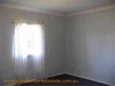  22 Granite St Stanthorpe QLD 4380 $185,000 4 bedroom low set residence Separate lounge Country style kitchen with gas stove & wood stove with wet back hot water system Modernized bathroom with shower Wood burning fire box  Large carport at rear plus a store room Rental? - $240 per week return Iron roof, rendered exterior, town water & sewerage Fully fenced ¼ acre allotment handy to town CBD and Quartpot Creek parklands This is a sturdy home with plenty of space and in a handy position. Category House Property ID H2999 