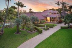  38 Ridley Rd Bridgeman Downs QLD 4035 A Private Retreat with Resort Facilities A true sense of arrival is experienced upon approaching the residence via a long drive bordered by manicured lawns and majestic trees. Set well back and concealed from neighbouring properties by the lush foliage, the expansive residence takes full advantage of its generous grounds and North-East orientation. An impressive formal entry showcases a glass feature wall and a stunning integrated aquarium with vibrant tropical fish. Once inside, an extremely flexible and livable floor plan is offered with an extensive choice of living and entertaining areas and ample accommodation for friends, family and guests. To the left of the foyer is a spacious formal lounge room. A gas fire place with stone mantle is the focal point of the room. The lounge is adjoined by a generous formal dining room which showcases a beautiful chandelier. Both rooms boast large windows which provide an abundance of natural light and views of the gardens and swimming pool. To the right of the foyer is the casual dining and family room. It opens through large sliding doors to an outdoor entertaining terrace which overlooks the leafy grounds. The terrace features a gabled roof and enjoys a perfect North-East orientation, making it an ideal spot for year round entertaining and relaxing. The well-appointed kitchen is centrally located between the formal and informal living areas. It comprises a full complement of stainless steel appliances, including Ilve oven and Miele combi-oven, dishwasher, integrated coffee machine and plate warmer. Neutral tones have been selected for the cabinetry which also feature soft-close mechanism and quartz stone bench tops. The kitchen also boasts a huge butler’s pantry with sink, open shelving and integrated food scales. Adjacent the kitchen is a sunken recreation/TV room. Oversized timber doors slide open to the outdoors and a pathway leading to a beautiful gazebo which overlooks the pool and the tennis court beyond. The main house offers four bedrooms in total, with the generous master bedroom enjoying a private position at the end of the hall. More like a luxury hotel suite, the master is distinguished by a glamorous open plan ensuite, spacious His & Her walk-in-robes and a private terrace with tranquil water-feature. A second bedroom is located on the ground level and is serviced by the stylish family bathroom. Two additional bedrooms are located on the upper level of the home. These bedrooms are separated by a casual lounge/retreat. One bedroom can function as a second master, having a huge walk-in-robe, large ensuite with spa bath and north facing terrace. The other bedroom also enjoys a north-east aspect, ensuite and has a built-in-robe. A state-of-the-art home theatre room is tucked away on the ground level. It features a massive viewing screen, surround sound and electric block out curtains. The expansive grounds offer resort style facilities including a North-South tennis court, 15m swimming pool, gazebos and a beautiful summer house.  The north-facing summer house is enormous and can accommodate the most elaborate of parties. Oversized, frameless glass door retract to open the entire room to the outdoors. It features shower and toilet facilities and a fully equipped kitchen with gas BBQ, teppanyaki plate, dishwasher, fridge and sinks. One of the most versatile features of the property is a fully self-contained guest house located to the rear of the main residence. Ideal as a granny-flat, guest/nanny quarters or for adult children living at home; it comprises a bedroom, bathroom, kitchenette and living area.  It is adjoined by a huge garage with space for approximately 6 cars. This space is ideal for use as a large work shop or for car and boat enthusiasts. It may also be further developed for additional living space. Seldom does a property claiming such significant land size, privacy and spectacular entertaining facilities become available this close to the CBD.  This is an incredible opportunity to secure a dream home and an exclusive lifestyle.   Features Grounds: 7023m2 of Private, Fully Landscaped Grounds Ideal North-East Orientation Floodlit North-South Tennis Court Sparkling Swimming Pool (approx. 15m) Enormous Summer House with full kitchen and bathroom facilities Pool and Tennis Court Gazebos   Main House: 4 Bedrooms & 4 Bathrooms (3 ensuites) Formal Entry with Aquarium Formal Lounge (Fire Place) & Dining Room Casual Family & Meals Area Concealed Home Office North-East Terrace Sunken Recreation/TV Room Home Theatre Room 2 Car Lock up Garage plus additional Carport   Villa House: Fully Self- Contained Living Quarters 1 x Bed 1 x Bathroom 6 x Car Accommodation (opportunity for further development) Additional Features Ducted Air and Ceiling Fans Piped Music throughout including Outdoors Back to Base Security Security Screens Irrigation System 