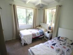  874 Terania Creek Rd Terania Creek NSW 2480 $575,000 Approximately 50 lush acres positioned 10 minutes drive from the beautiful Nightcap National Park and Protestors Falls. Recently renovated 4 bedroom home. The modern, refurbished kitchen includes a butchers bench and five burner gas stove. The kitchen opens out into an airy dining/living area that has polished timber floors and sliding doors that lead out onto beautiful, wide verandahs. There is a private, second dwelling that has been recently renovated and offers self-contained living and privacy from the main house.  Huge, undercover area that has enough room for four cars! Tastefully landscaped with a terraced vegetable garden and walking tracks that take in the large variety of fruit trees. Access to your very own, secluded swimming hole positioned on Terania Creek. Photos do not do it justice! Solar hot water, 3x 5000 gallon (total approx 60,000 litres) tanks and mains power. Phone reception and internet available. The acreage has a balance of cleared, elevated areas with views over Terania Creek Valley and beautiful, ancient stands of rainforest. There is also a second creek and dam located on the property. A school bus goes past the front gate. With so much to offer, why not inspect 