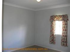  22 Granite St Stanthorpe QLD 4380 $185,000 4 bedroom low set residence Separate lounge Country style kitchen with gas stove & wood stove with wet back hot water system Modernized bathroom with shower Wood burning fire box  Large carport at rear plus a store room Rental? - $240 per week return Iron roof, rendered exterior, town water & sewerage Fully fenced ¼ acre allotment handy to town CBD and Quartpot Creek parklands This is a sturdy home with plenty of space and in a handy position. Category House Property ID H2999 