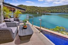  46 Cowan Drive Cottage Point NSW 2084 Price: Expressions Of Interest 1,443 sqm North Facing Deep-Waterfront Dream An exquisite connection of luxury with nature in one of only 52 private residences to exist in one of Pittwater's most exclusive waterfront enclaves which enjoys breathtaking due north facing water and unbeatable Australian bushland panorama to Looking Glass Bay and Ku-Ring-Gai Chase National Park. Cottage Point is one of Sydney's smallest yet most scenic unspoiled foreshore spots but best of all, only a 45 minute drive from your CBD office or city home. Driving distance to Terrey Hills and to Avalon shopping village and not much further Palm Beach restaurants and cafes.  An architectural triumph constructed around a spectacular natural feature rock you will soon discover a beautifully designed retreat with immense space, style and comfort. This sophisticated residence on a grand scale has it all – 5 spacious bedrooms (2 with mezzanine lofts), home office, large entertaining decks, elegant timber ceilings, formal dining and informal dining areas and that place to park the water vessel of your desire. Sea plane and ferry spotting may become one of your many favourite things to do whilst looking out from within through the double-height glass sun-soaked windows. Entertaining has never been made easier with a commercial size bar, a spectacular chef's caesar stone benchtop kitchen with Meile appliances and a dining room with romantic views on dusk which simply take your breath away. Perched on the water's edge is a self-contained boathouse with 2 loft bed areas, gas kitchen and bathroom with shower. A private deep-water jetty completes the picture.  This entire property has been meticulously renovated with updated kitchen and bathrooms, new plumbing, new electrical systems, and freshly painted both inside and out.  Features to note: - 5 bedrooms, 2 with extra mezzanine lofts - Master bedroom with ensuite, walk in robe and views - Separate formal dining and casual living areas with views - Deep 15 metre decked swimming pool, heated spa and bbq entertaining - Self-contained boathouse with bedrooms, kitchen and bathroom - Deep-water jetty , boat winch and inclinator  - Level from the street 5-car garage with internal access, plus off-street parking - Back-to-base security with ADT, reverse cycle air conditioning. The close-knit Cottage Point community mostly comprises owner-occupiers and offers a peaceful waterside lifestyle in one of Sydney's tiniest and most beautiful suburbs. For a private inspection, call Gavan Kohen on 0414 911 070. Inspection Times Or By Appointment PROPERTY OVERVIEW Property ID: 1P5814 Property Type: House Building Size: 1443 m² Carport: 5 Aspect: North FEATURES Air Conditioning Built-In Wardrobes Alarm System Pool Water Front Close to Schools Ensuite Water Views Ocean Views Security Access Security System 