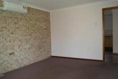 4/5 Dunlop Close Singleton NSW 2330 $169,000 GREAT PRICE UNDER $170,000!! * RESERVE OUTLOOK * LOW MAINTENANCE LIVING Tidy two bedroom end unit in a well kept complex of just 4 * quiet cul-de-sac position and adjoining and overlooks reserve * carpeted main lounge with split system air conditioner * combined kitchen and dining area * internal laundry with access to rear courtyard * main bedroom double in size with large window looking over reserve * functional bathroom * detached carport * walking distance to school, shops, RSC Club and sporting fields * low maintenance living in a small unit complex * easy renovation with quick posession available and all at a great price! Council Rates $1300 p/a Strata Levy $520 p/q 