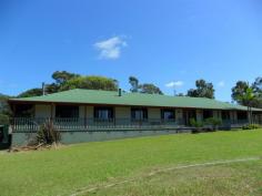  1807 Coomba Rd Coomba Park NSW 2428 $689,000 Classic Home - 22 Acres - Pool - 'Avalon' is a fabulous and private 22 acre property with a classic 4 bedroom country homestead with 9ft ceilings, wrap around verandahs plus additional seperate self-contained flat and large paved covered spanline enteraining/BBQ area leading out to the in-ground pool. Mostly cleared, but with lovely stands of timber throughout and Wallis Lake views, 'Avalon' also has two large sheds for all your 'toys', 3 dams, and is fully fenced - the ideal easy care coastal acreage, ready and waiting for you!  Features include: Formal entry 9ft Ceilings Tiled througout for easy care and low maintenance Open plan kitchen & family room Formal dining Formal Lounge with combustion fire Separate ajoining self-contained guest accommodation (or rumpus room) also with combustion fire Office - Loads of storage cupboards Spanline covered BBQ/enteraining area 4 Bedrooms - carpeted - all with built-inrobes Master bedroom with walk-in robe & ensuite 3 Bathrooms 4 Paddocks 3 Dams Fenced 16 Solar electricity panels feeding back to the grid If you are looking for peace, privacy and room to roam then 'Avalon' is a must inspect, located under 20 minutes drive from local world class surf beaches at Pacific Palms. Download your free brochure now and call David Shaw or Troy Perrim on (02) 6554 0188 to arrange your private viewing of 'Avalon' you won't be disapointed. Forster Pacific Real Estate, Pacific Palms - Boutique Coastal Property Specialists... ***Stock & Station Agents***Auctioneers***Real Estate Agents***Property Managers*** Property: 	 House Bedrooms: 	 4 Bathrooms: 	 3 Parking: 	 6 Rooms: 	 Lounge/Living Office Rumpus Room Workshop Family Room Dining Room Pool: 	 Yes Features: 	 Barbecue Area Additional Storage Local Amenities: 	 Schools Community Centre Bus Service Shops Child Care Centre Playground Park Zoning: 	 Rural / Residential Council: 	 Great Lakes 