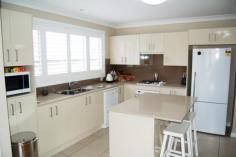  9 Koraaga Rd Gerringong NSW 2534 FOR SALE $575,000 Property Facts Property ID2843783Property TypeHouse For SalePrice$575,000Land Size-House Size-Council Rates-Water Rates-Strata Levy-Tender Date N/A Inspection Times Saturday, 11 April 201511:30AM - 12:00PM        Impeccable Town House FOR SALE $575,000 Image GalleryPrint A BrochureEmail A FriendBookmark Property More Sharing Services Located just metres from farmland and only a short walk to Gerringong public school is this immaculately presented 3 bedroom dual occupancy town house. All rooms are double size with the main bedroom having an ensuite and there is plenty of winter sun in the north facing living room which also enjoys views over the escarpment. The kitchen really is a good size which looks out to the covered outdoor entertaining/ sitting area which has a fenced lawn for littlies or small pets. There's room for a car plus storage in the big garage and also a car port for more off street parking and other bonuses include plantation shutters, ceiling fans in all rooms, gas heating and security screen mesh door. This really is a quiet part of town where you can sit on the hardwood front deck and watch the cows grazing out in the paddocks and its only minutes away from both 7 mile and Werri beach, what a fantastic place to live!! 