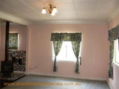  22 Granite St Stanthorpe QLD 4380 $185,000 4 bedroom low set residence Separate lounge Country style kitchen with gas stove & wood stove with wet back hot water system Modernized bathroom with shower Wood burning fire box  Large carport at rear plus a store room Rental? - $240 per week return Iron roof, rendered exterior, town water & sewerage Fully fenced ¼ acre allotment handy to town CBD and Quartpot Creek parklands This is a sturdy home with plenty of space and in a handy position. Category House Property ID H2999 