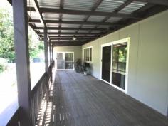  874 Terania Creek Rd Terania Creek NSW 2480 $575,000 Approximately 50 lush acres positioned 10 minutes drive from the beautiful Nightcap National Park and Protestors Falls. Recently renovated 4 bedroom home. The modern, refurbished kitchen includes a butchers bench and five burner gas stove. The kitchen opens out into an airy dining/living area that has polished timber floors and sliding doors that lead out onto beautiful, wide verandahs. There is a private, second dwelling that has been recently renovated and offers self-contained living and privacy from the main house.  Huge, undercover area that has enough room for four cars! Tastefully landscaped with a terraced vegetable garden and walking tracks that take in the large variety of fruit trees. Access to your very own, secluded swimming hole positioned on Terania Creek. Photos do not do it justice! Solar hot water, 3x 5000 gallon (total approx 60,000 litres) tanks and mains power. Phone reception and internet available. The acreage has a balance of cleared, elevated areas with views over Terania Creek Valley and beautiful, ancient stands of rainforest. There is also a second creek and dam located on the property. A school bus goes past the front gate. With so much to offer, why not inspect 