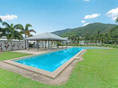  57/2-6 Fairweather Road Kamerunga Qld 4870 This modern unit is big enough for a small family. It is located in a secure gated complex within walking distance to local shopping, hotel, parks and public transport. The upstairs location provides a great outlook to nearby mountain ranges and enjoys cool breezes. Features include;  - Full sized kitchen - modern appliances and servery to the balcony  - Open plan living/dining room - quality Fujistu split air conditioner  - Main bedroom - ensuite bathroom, walk in wardrobe, quality Fujitsu split air conditioner and personal door to the balcony.  - Second bedroom - queen bed size, walk in wardrobe and quality Fujitsu split air conditioner and personal door to balcony.  - Third room - large enough for a bedroom, parents retreat, home office or nursery.  - Internal laundry.  - Massive covered balcony - enjoy the elevation and cool breezes.  - Lock-up garage with automatic roller door - secure your vehicle The complex is meticulously maintained by on-site managers with tropical gardens, two large resort style pools and BBQ gazebo. It is a short stroll to shopping facilities & public transport and a 2 minute drive to schools and supermarkets. An easy 15 minutes drive will take you to Cairns CBD and International Airport. Auction onsite 11:00am Saturday 11th April 2015. Features General Features Property Type: Unit Bedrooms: 3 Bathrooms: 2 Outdoor Carport Spaces: 1 