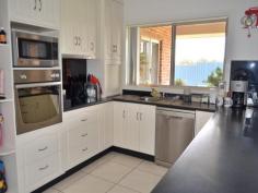  4 Kurrawong Street Temora NSW 2666 $480,000 Brick & 5 Acres Who wants the headache of Building?  Call and make appointment today to view this lovely family home, which offers a warm cosy secluded atmosphere.  The big plus is the 4 large bedrooms all with BIRs and carpeted. Main bedroom features ceiling fan and ensuite.  Kitchen has plenty of cupboard space, pantry, dishwasher and stainless steel appliances- very nice!  Laundry tiled with cupboards and folding table.  The open plan dining/ lounge room and a bonus of a secluded parents retreat, gives you two family rooms, all rooms have large windows allowing for lots of light.  Double garage with storage along on side means less clutter!  Workshop with large tank for the garden & lawn.  Paved undercover BBQ area.  Huge enclosed yard with cubby house for littlies.  Must be seen to be appreciated  Vendors realistic For Sale $480,000 Features General Features Property Type: House Bedrooms: 4 Bathrooms: 2 Land Size: 2.02ha (5.00 acres) (approx) Indoor Built in Wardrobes Dishwasher Ducted Heating Ducted Cooling Outdoor Remote Garage Secure Parking Garage Spaces: 4 Outdoor Entertaining Area Shed Fully Fenced Eco-friendly Water Tank Inspections Inspections by appointment only 