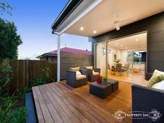  5/122 Waverley Street Annerley Qld 4103 $649,000 + A Striking Statement in Style Striking from every angle, this brand new residence showcases luxurious proportions over 3 levels, sublime finishes and exceptional functionality.  Sophisticated living and dining spaces ideal for entertaining are enhanced by expansive outlooks and polished hardwood flooring whilst inviting out through full height sliding doors to 2 alfresco entertaining areas overlooking landscaped gardens. The outdoor private balcony and alfresco terrace are served by an impressively appointed kitchen boasting a full complement of Miele appliances, 2 pac cabinetry, architectural features, Caesar stone benches and Olivieri under mount sinks.  An architectural emphasis on quality, luxurious interiors and natural light creates modern, bright living areas that are perfect for entertaining on those long summer nights. Three bedrooms include the stunning master bedroom with fitted built in robes and ensuite offer restful sleeping quarters. The central bathroom with imported Italian tiles give a modern, sleek finish. Further complemented with ducted air conditioning, video intercom, double remote garage with internal access, and BBQ gas points, this residence is truly a striking statement in style. 