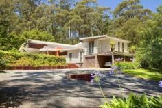  16 Panorama Rd Bundanoon NSW 2578 Private Oasis In Bundanoon House - Property ID: 777619 PRICE GUIDE $699,000-799,000 WATCH THE FULL HD MOVIE ON DOMAIN,REAL ESTATE.COM OR PROFESSIONALS SOUTHERN HIGHLANDS WEBSITE A peaceful private haven set amongst mature landscaped low maintenance gardens, this quality modern contemporary split level home is situated in one of the best addresses in Bundanoon. The sweeping tree lined driveway swings round to showcase this elevated family home which overlooks the 16 metre lap pool and gentle, manicured gardens. This home is an entertainer's delight with its spacious open plan kitchen, dining and living room that leads onto the tiled alfresco deck. The surround sound music system is also piped through to the alfresco area and pool. The designer kitchen has soft close cupboards and doors, caesarstone bench tops, modern European appliances and is the light filled hub of the home. A generous laundry/utility room is situated off the kitchen with another toilet. A separate study area leads off to the 4 generous light-filled bedrooms. The master and guest bedroom both boast walk in robes and generous modern ensuites. The master has it's own private balcony overlooking the gardens. The 2 remaining double bedrooms are serviced by the generous family bathroom. Zoned under floor heating throughout this home keeps you beautifully warm and the gas open fireplace in the living area adds to the ambiance. Set on 3,081 square metres of private gardens this oasis is sure to please even the most discerning buyer. Quality, style, position and privacy ...this home has got it all.   Video Email Alerts Features  Land Size Approx. - 3081 m2 