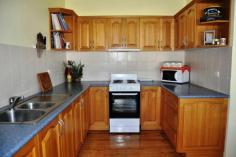  178 Mayne St Gulgong NSW 2852 $375,000 HIDING BEHIND THE TREES This quintessential family home offers an array of spectacular spaces both inside and out. The double brick rendered home is made up of 3 large bedrooms all with built in robes and ceiling fans the master also with air conditioning. The light filled country kitchen has plenty of cupboard space and offers both dine in and alfresco dining through the French doors on to the private leafy patio. The spacious living room has a real feeling of warmth and is a central hub of this family home, a formal living room or games / kids living room is adjoining.  Linked to the main house via a sun room is a neat and tidy fully self contained one bedroom granny flat with air conditioning and its own separate power meter. Boasting a 1721m2 fully fenced corner block and backing on to the Gulgong golf course gives you a real feeling of space and privacy as you only have one neighbouring property. Possible subdivision opportunity also exist subject to council approval. The established Australian native garden surrounds the home to create your own private sanctuary with multiple outdoor entertaining areas. The car is not forgotten here with a double garage and workshop plus two carports. All in all a very well presented property with lots to offer.   Inspection Times Contact agent for details Features Entertaining Area Established Gardens Rear Lane Access Built In Robes Floorboards Fully Fenced Open Fireplace Outdoor Entertaining Rumpus Room Secure Parking Shed Water Tank Workshop Land Size 1721 m2 