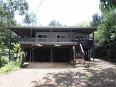  874 Terania Creek Rd Terania Creek NSW 2480 $575,000 Approximately 50 lush acres positioned 10 minutes drive from the beautiful Nightcap National Park and Protestors Falls. Recently renovated 4 bedroom home. The modern, refurbished kitchen includes a butchers bench and five burner gas stove. The kitchen opens out into an airy dining/living area that has polished timber floors and sliding doors that lead out onto beautiful, wide verandahs. There is a private, second dwelling that has been recently renovated and offers self-contained living and privacy from the main house.  Huge, undercover area that has enough room for four cars! Tastefully landscaped with a terraced vegetable garden and walking tracks that take in the large variety of fruit trees. Access to your very own, secluded swimming hole positioned on Terania Creek. Photos do not do it justice! Solar hot water, 3x 5000 gallon (total approx 60,000 litres) tanks and mains power. Phone reception and internet available. The acreage has a balance of cleared, elevated areas with views over Terania Creek Valley and beautiful, ancient stands of rainforest. There is also a second creek and dam located on the property. A school bus goes past the front gate. With so much to offer, why not inspect 