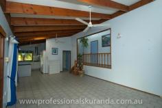  6 Outlook Cres Kuranda QLD 4881 $595,000 Almost 5 acres close to the Village House on Acreage - Property ID: 767789 This beautiful 4.7 acre property sits atop a hill at the end of a cul-de-sac and is only 5 minutes from Kuranda Village. Not far from shops and school for the kids. The property is fully fenced and is zoned rural residential so, you can keep a couple of horses or even some cows or goats. There are stables, a workshop and double shed to store feed or a vehicle. A permanent creek runs through the back boundary of this property to water the animals or even for a dip in summer! Wallabies graze on the grass and rest under the shady trees. The house is steel frame, hardy plank construction with 3 bedrooms, bathroom and ensuite off the master bedroom. There are built in wardrobes in all of the bedrooms. A recently renovated kitchen comes with a family size fridge. High ceilings, air-conditioning in the rooms and fans keep this house cool in summer. A combustion wood fired stove keeps the place warm in winter. In the afternoons you can sit on the timber deck enjoying a drink and the beautiful views of the rainforest on your property.  There is a small office, from which you could run your own business. A double carport is at the entrance to the house.  Solar panels have been installed on the roof and feed back to the grid. The Inverter is 5 kw The 26 panels are 6.5 Kw for extra performance It at times produces 35+ Kwh in a day Acreage properties close to town like this rarely come up for sale in Kuranda, so get in quick!  Print Brochure Email Alerts Features  Land Size Approx. - 1.76 hectares  4.7 acres  close to Kuranda VIllage  solar panels  permanent creek  mountain views  3 bedrooms 