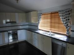 78 Daintree St Clermont QLD 4721 $310,000 NEG PRICED TO SELL!! BIG ON ROOM - SMALL ON PRICE! Nestled on a 607m² freehold block in the heart of town, this home ticks all the boxes! Featuring: - 3 carpeted bedrooms (built-ins to the main)  - Beautifully renovated kitchen with walk-in pantry, loads of cupboards and bench space, polished timber flooring, stainless cooktop, oven, rangehood and dishwasher - Massive open plan lounge/dining area - Classy renovated bathroom with tiled floor, bathtub, shower, vanity, linen cupboard and cubed glass feature window - Split system air-conditioning and ceiling fans throughout - Front timber deck - Downstairs is fully concreted with a separate air-conditioned room which could be used as a 4th bedroom or office, renovated laundry and 2nd shower and toilet, underhouse parking for 2 vehicles, and plenty of storage space  - Fully fenced back yard COME AND INSPECT TODAY - CALL LJ HOOKER CLERMONT ON 07) 49831 011   Property Snapshot  Property Type: House Construction: Weatherboard Land Area: 607 m2 Features: Balcony Built-In-Robes Close to schools Dining Room Dishwasher Fenced Back Yard Lounge Polished Timber Floors Renovated Security Screens Storage 