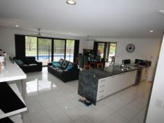  12-14 Paine Pl Kooralbyn QLD 4285 $469,000 ABSOLUTELY STUNNING For those who want the best this is a must to inspect. When you walk in the door you will be impressed by the sheer quality of this home. At one end of the house you have a double size master bedroom with WIR and ensuite with spa bath, a study and a purpose built home theatre room. At the othe end you have 3 double bedrooms, luxurious bathroom, formal dining room or extra office space, laundry and double lock up garage with storage areas and remote access. You will also delight in the gourmet kitchen which adjoins the large lounge and dining area overlooking the inground lap pool and large rear yard with fencing and 2 yards for horses and other animals. Words cannot fully explain the feeling you get from such an impressive home, it has to be inspected to fully appreciate it.   Property Snapshot  Property Type: House Construction: Brick House Size: 260.00 m2 Land Area: 7,124 m2 Features: Built-In-Robes Ceiling Fans Close to schools Dining Room Dishwasher Ensuite Established Gardens Family Room Fenced Back Yard Formal Dining Room Fully Fenced Yard Garden Shed Gas In-Ground Pool Internal Access via Garage Landscaped Gardens Lounge Outdoor Living Parents Retreat Pool Remote Control Garaging Rumpus Room Security Screens Storage Study Walk-In-Robes 