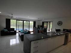  12-14 Paine Pl Kooralbyn QLD 4285 $469,000 ABSOLUTELY STUNNING For those who want the best this is a must to inspect. When you walk in the door you will be impressed by the sheer quality of this home. At one end of the house you have a double size master bedroom with WIR and ensuite with spa bath, a study and a purpose built home theatre room. At the othe end you have 3 double bedrooms, luxurious bathroom, formal dining room or extra office space, laundry and double lock up garage with storage areas and remote access. You will also delight in the gourmet kitchen which adjoins the large lounge and dining area overlooking the inground lap pool and large rear yard with fencing and 2 yards for horses and other animals. Words cannot fully explain the feeling you get from such an impressive home, it has to be inspected to fully appreciate it.   Property Snapshot  Property Type: House Construction: Brick House Size: 260.00 m2 Land Area: 7,124 m2 Features: Built-In-Robes Ceiling Fans Close to schools Dining Room Dishwasher Ensuite Established Gardens Family Room Fenced Back Yard Formal Dining Room Fully Fenced Yard Garden Shed Gas In-Ground Pool Internal Access via Garage Landscaped Gardens Lounge Outdoor Living Parents Retreat Pool Remote Control Garaging Rumpus Room Security Screens Storage Study Walk-In-Robes 