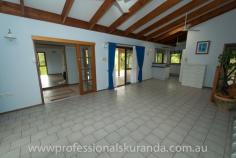  6 Outlook Cres Kuranda QLD 4881 $595,000 Almost 5 acres close to the Village House on Acreage - Property ID: 767789 This beautiful 4.7 acre property sits atop a hill at the end of a cul-de-sac and is only 5 minutes from Kuranda Village. Not far from shops and school for the kids. The property is fully fenced and is zoned rural residential so, you can keep a couple of horses or even some cows or goats. There are stables, a workshop and double shed to store feed or a vehicle. A permanent creek runs through the back boundary of this property to water the animals or even for a dip in summer! Wallabies graze on the grass and rest under the shady trees. The house is steel frame, hardy plank construction with 3 bedrooms, bathroom and ensuite off the master bedroom. There are built in wardrobes in all of the bedrooms. A recently renovated kitchen comes with a family size fridge. High ceilings, air-conditioning in the rooms and fans keep this house cool in summer. A combustion wood fired stove keeps the place warm in winter. In the afternoons you can sit on the timber deck enjoying a drink and the beautiful views of the rainforest on your property.  There is a small office, from which you could run your own business. A double carport is at the entrance to the house.  Solar panels have been installed on the roof and feed back to the grid. The Inverter is 5 kw The 26 panels are 6.5 Kw for extra performance It at times produces 35+ Kwh in a day Acreage properties close to town like this rarely come up for sale in Kuranda, so get in quick!  Print Brochure Email Alerts Features  Land Size Approx. - 1.76 hectares  4.7 acres  close to Kuranda VIllage  solar panels  permanent creek  mountain views  3 bedrooms 