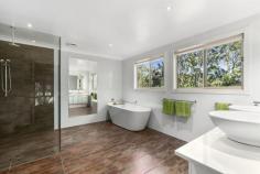  30 Mary Bale Dr Tallebudgera QLD 4228 Offers over $1,299,000 Thoughtfully designed and flawlessly appointed this home offers the rare combination of an opulent acreage lifestyle with the convenience of being ideally located 10 minutes to the pristine beaches of Burleigh Heads.  The residence presents on a private 5663m2 block with immaculate established gardens and superior security system installed to set your mind at ease.  - 5 bedrooms plus office, 3.5 bathrooms, 4 car garage. - Large formal lounge with formal dining and additional rumpus and music room. - Executive master suite with WIR and ensuite. - Gourmet chef's kitchen with stone bench top and gas cook-top. - Flowing open plan living and dining off kitchen opening to outdoors. - Wonderful spa, gymnasium and workshop. - Outdoor entertaining fit for large numbers, huge undercover timber decks. - Sparkling in-ground pool with flowing waterfall.  - Voice intercom, alarm system including CCTV cameras.  - Crimsafe security screens, solar power electricity. - The main & ensuite bathrooms include floor heating. - Air-conditioning and fans throughout. - Vacuum maid integrated in the residence. - Secure garaging for up to 4 vehicles. - An inspection is a must!! Set amongst a picturesque setting and home to koalas, kangaroos, kookaburras and only minutes to schools, shops, sporting grounds, golf courses, major shopping and not even 10 minutes to the golden sands of Burleigh Heads Beach. This is truly a sanctuary to escape to and enjoy every day, whether you have a large family, looking to run a home business or just searching for a bush land hideaway the potential in this stunning Tallebudgera Springs estate is infinite.  Print Brochure Video Virtual Tour Email Alerts Features  Land Size Approx. - 5663 m2 